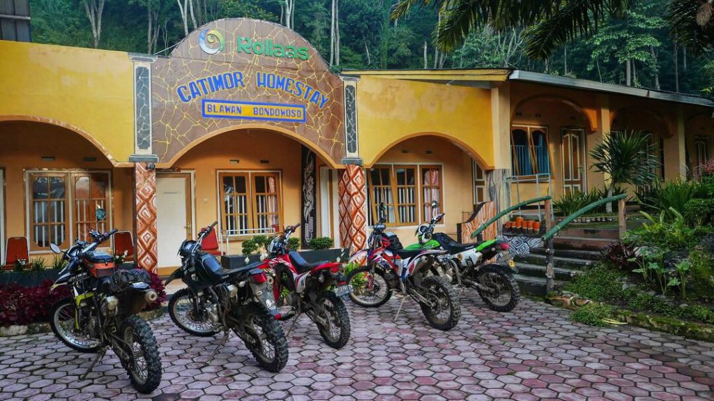 The Enduro Motorcycles are parked in front of the Catomor Homestay inside Wurung crater